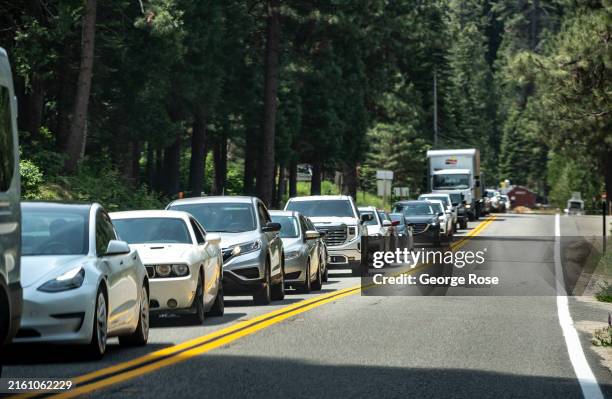 Line of cars creep slowly from Fish Camp toward the western Highway 41 entrance of Yosemite National Park as viewed on June 18 just outside Yosemite...