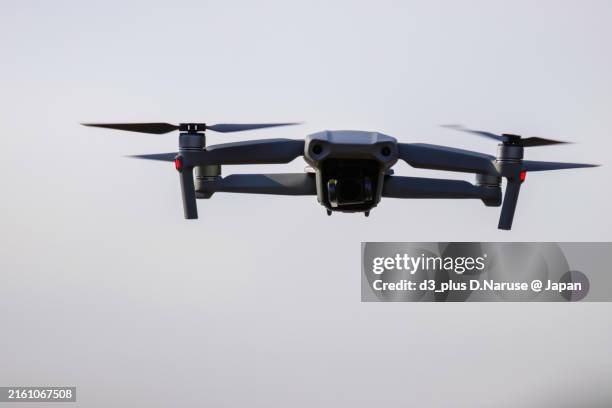 taking aerial photos to survey hirizohama and the surrounding islets and waters.the drone is flown with permission from the local fishing cooperative. - drone stock pictures, royalty-free photos & images