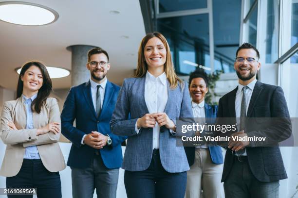 business team with female leader smiling - fato imagens e fotografias de stock