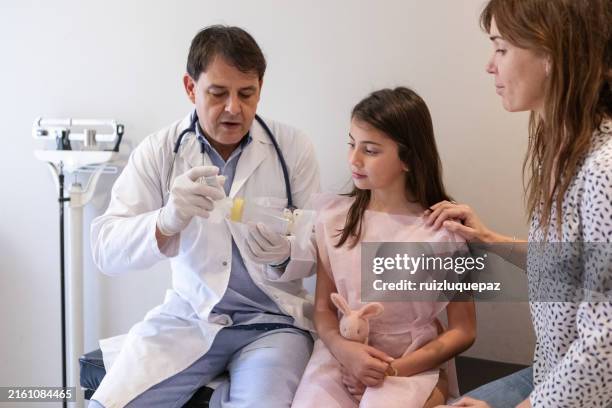 child receiving a nebulizer treatment, during a medical checkup with a pediatrician - pulmonology stock pictures, royalty-free photos & images