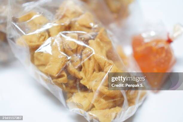 fried wontons in plastic bag - stuffed stock pictures, royalty-free photos & images
