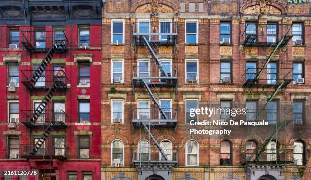 apartment buildings with fire escape stairs in new york city, usa - west village stock pictures, royalty-free photos & images