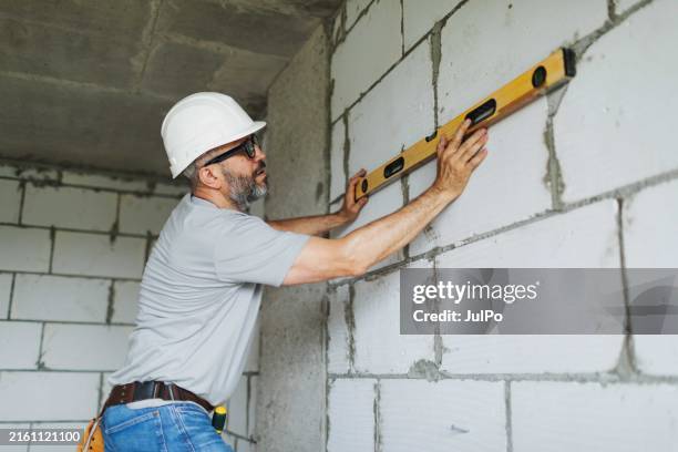 Man Using Level 2,789 Male Using Spirit Level Stock Photos, High-Res Pictures, and ...