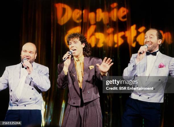 German singer and presenter Dennie Christian performing live on stage withh Dutch music duo Deurzakkers members Willem van Schijndel and Clemens van...