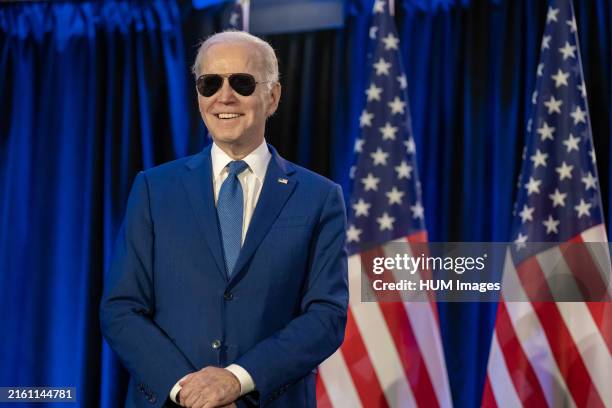 President Joe Biden looks on as First Lady Jill Biden delivers remarks at an embassy meet and greet, Thursday, March 23 at the Fairmont Chateau...