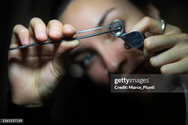 examining a precious gemstone - gemology stock pictures, royalty-free photos & images