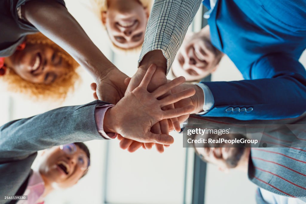 Huddle Team Huddle With Hands Stacked Together In Unity High-Res Stock Photo ...