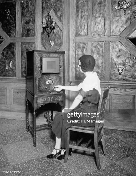 Woman with radio ca. 1910-1935.