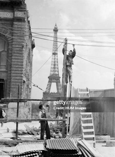 Construction work,in the background the Eiffel Tower ca. 1937.