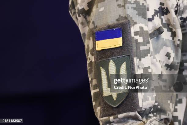 Ukrainian flag and arm of coat are seen on a uniform ahead of the NATO Summit in Washington DC, United States on July 9, 2024.