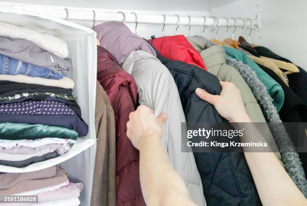 decluttering - winter coat stock pictures, royalty-free photos & images