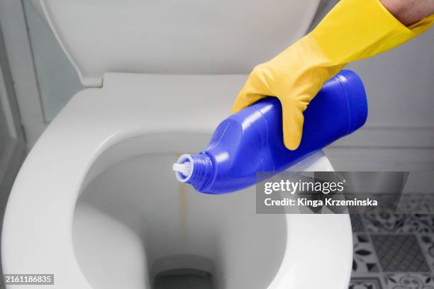 toilet cleaning - yellow glove stock pictures, royalty-free photos & images