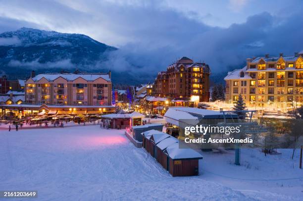 night view of ski resort in winter - canda village stock pictures, royalty-free photos & images