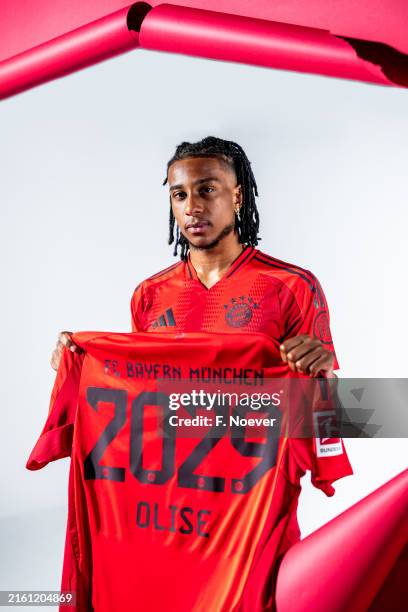 Michael Olise poses as he signs a contract with FC Bayern München on July 07, 2024 in Munich, Germany. The 22-year-old forward moves to Munich from...