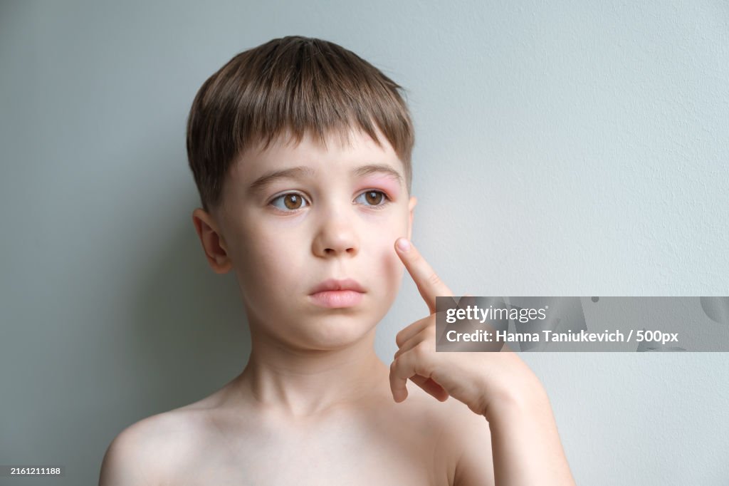 Close-up portrait of boy against wall
