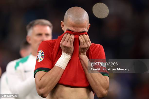 Tearful Pepe of Portugal reacts following the penalty shoot out defeat in the UEFA EURO 2024 quarter-final match between Portugal and France at...