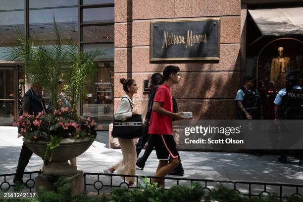 Sign marks the location of a Neiman Marcus store along the Magnificent Mile on July 08, 2024 in Chicago, Illinois. HBC, parent company of Saks Fifth...