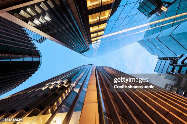 looking up at illuminated london skyscrapers - building exterior stock pictures, royalty-free photos & images