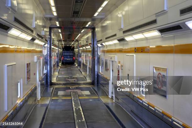 Le Tunnel sous la Manche: On board a Eurotunnel shuttle train for high vehicles, to England, UK, at the Calais terminal, on the north coast of...