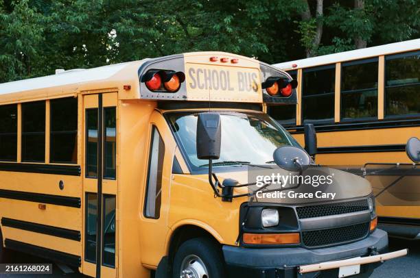 parked school buses - school bus stock pictures, royalty-free photos & images