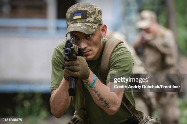 Former prisoner with the call sign "Palach" with tattoo "Only Got is my judge" who signed a contract to join the Ukrainian army do tactical training...