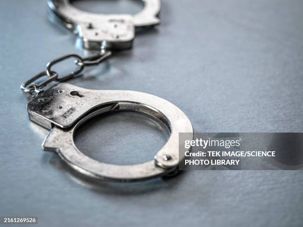 handcuffs - arrest stock pictures, royalty-free photos & images