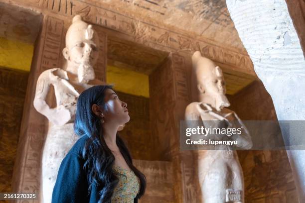 asian girl visiting abu simbel temple - africa rock art stock pictures, royalty-free photos & images