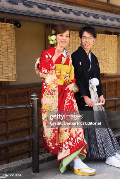 Young Japanese Couple In Traditional Wedding Kimonos; Kyoto, Japan.