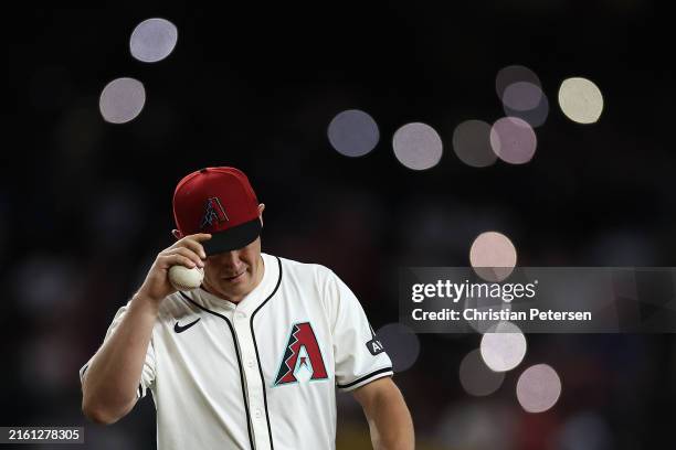 Relief pitcher Paul Sewald of the Arizona Diamondbacks prepares to pitch during the ninth inning of the MLB game against the Atlanta Braves at Chase...