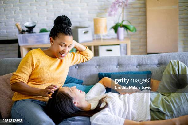 couple enjoying life together - black and asian lesbian stock pictures, royalty-free photos & images