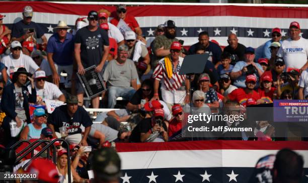 Republican presidential candidate, former U.S. President Donald Trump is swarmed by Secret Service after gunshots rang out at a rally at Butler Farm...