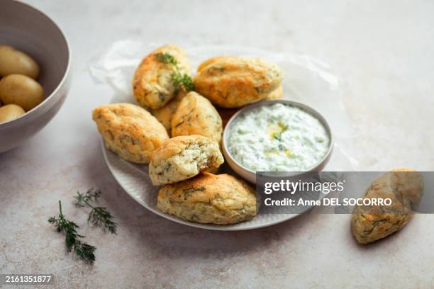 codfish accra with potato and dill yogurt sauce - dill stock pictures, royalty-free photos & images