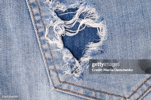 blue denim fabric texture background with yellow stitching - denim photos et images de collection