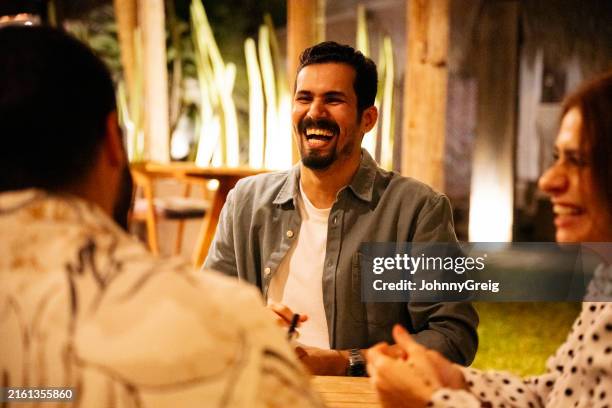 saudi vacationers relaxed and laughing - jeddah red sea stock pictures, royalty-free photos & images