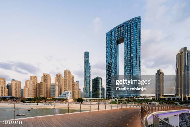 dubai marina beach and skyline at day - united arab emirates stock pictures, royalty-free photos & images