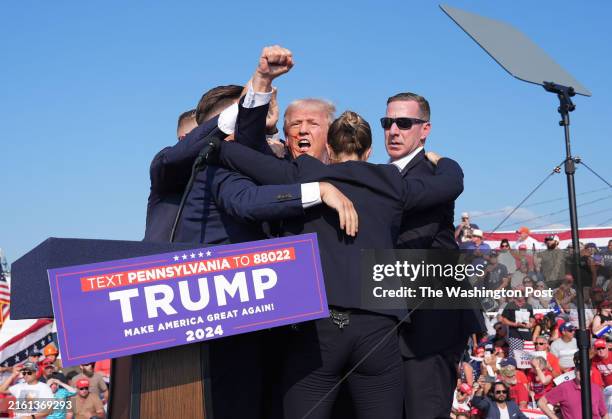 July 13: Former president Donald Trump raises his arm with blood on his face during a campaign rally for former President Donald Trump at Butler Farm...
