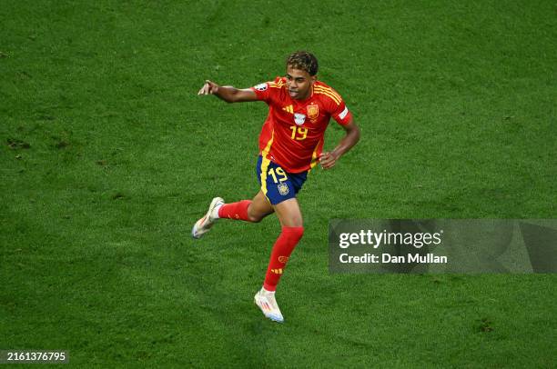Lamine Yamal of Spain celebrates scoring his team's first goal during the UEFA EURO 2024 Semi-Final match between Spain and France at Munich Football...