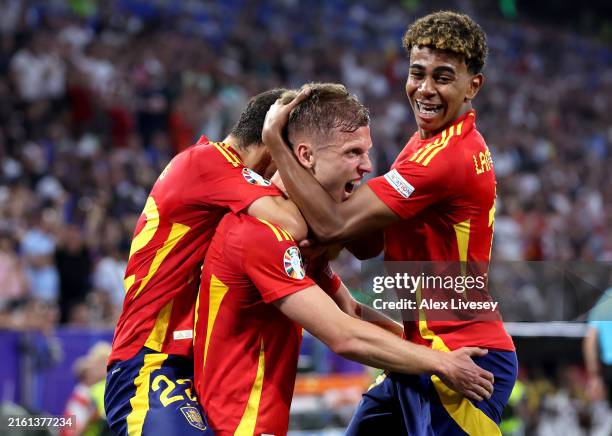 Dani Olmo of Spain celebrates scoring his team's second goal with teammate Lamine Yamal during the UEFA EURO 2024 Semi-Final match between Spain and...
