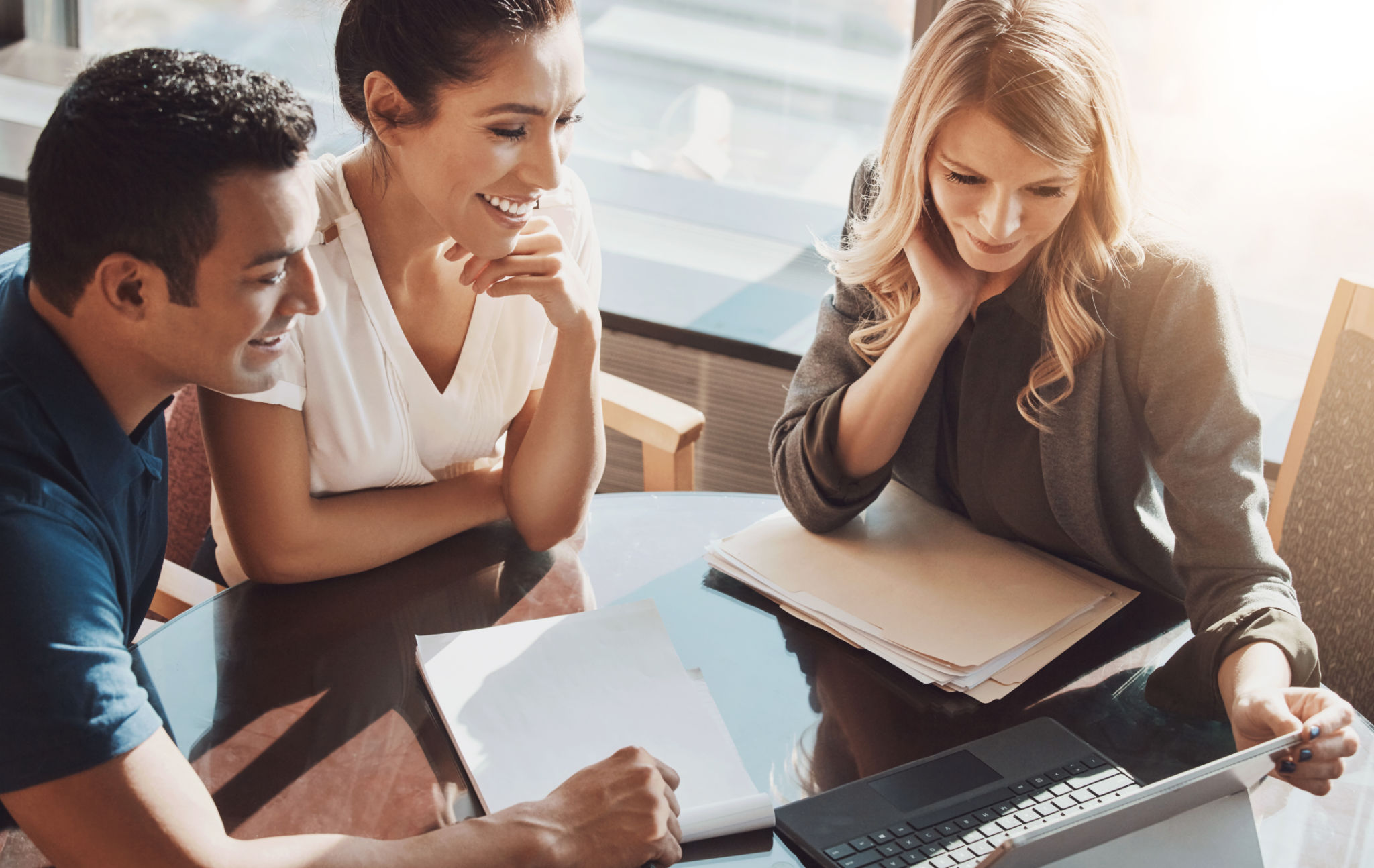 Group, people and laptop in office for business or online ideas, planning with client for blockchain investment. Female broker, couple and diversity in workplace with computer for research on crypto Group, people and laptop in office for business or online ideas, planning with client for blockchain investment. Female broker, couple and diversity in workplace with computer for research on crypto