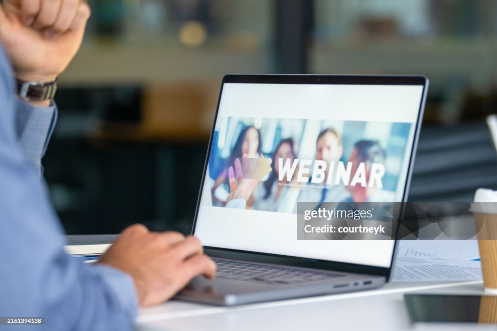 Businessman waiting for a Web conference to start.