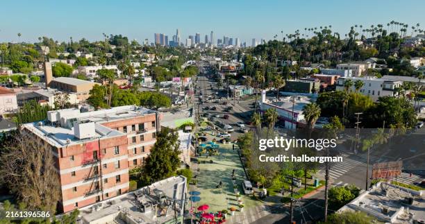 drone shot of downtown la from silver lake on sunny day - sunset-boulevard-los-angeles stock pictures, royalty-free photos & images