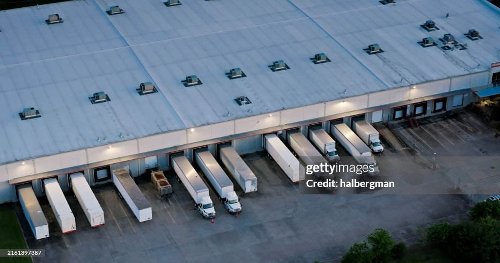 Birdseye Shot of Trucks Parked in Warehouse in Houston, Texas