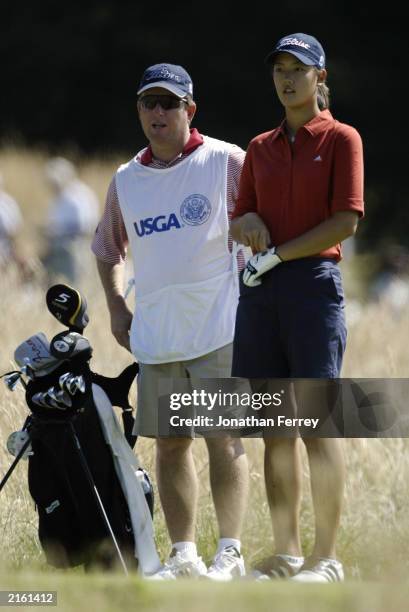 Michelle Wie stands with her caddie and coach Gary Gilchrist during the final round of the U.S. Women's Open at Pumpkin Ridge Golf Club on July 6,...