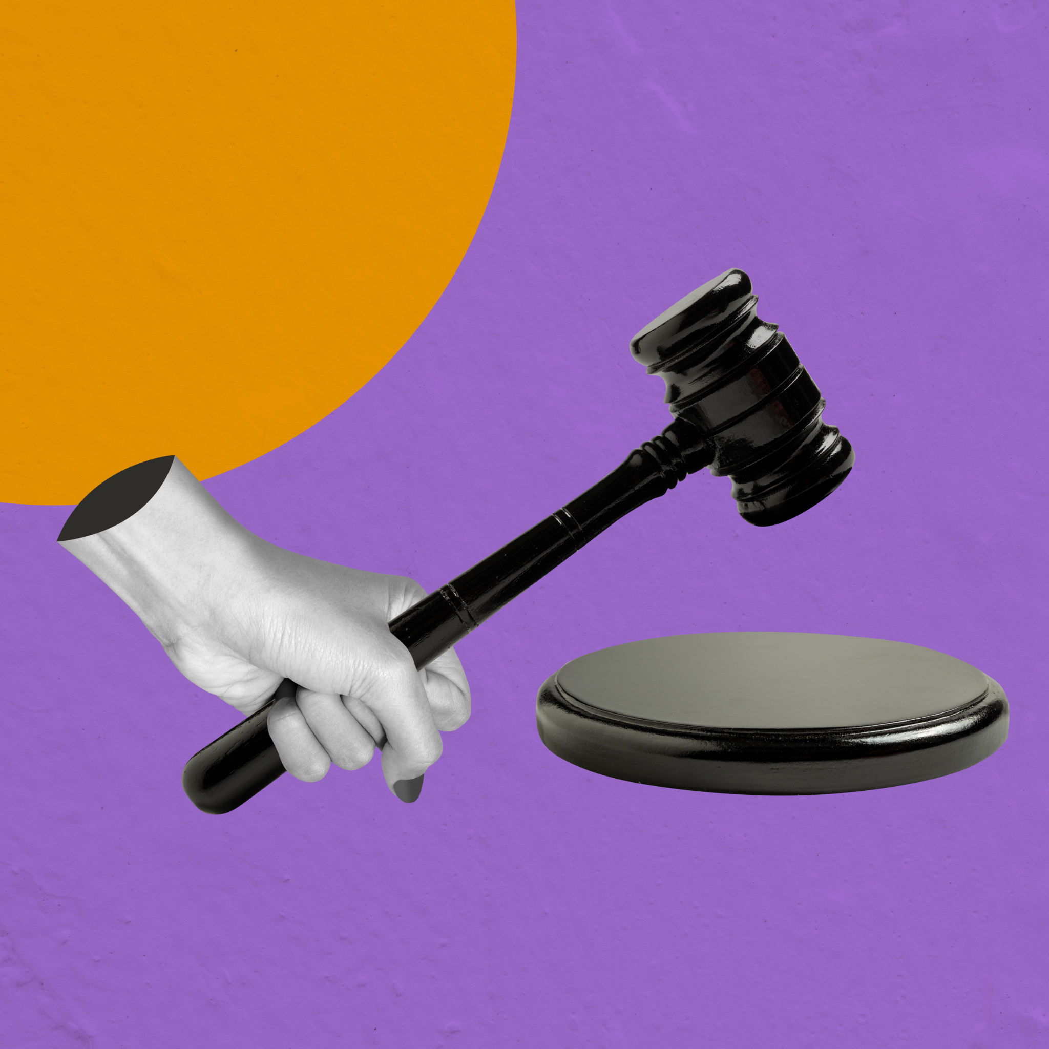 Human hand holding judge gavel Human hand holding judge gavel