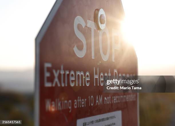 Sign reading "Extreme Heat Danger" warns visitors during a long-duration heat wave impacting much of the state on July 9, 2024 in Death Valley...