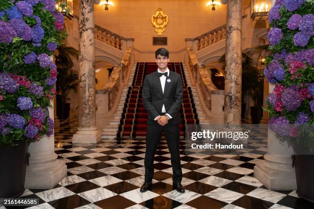 In this handout photo issued by AELTC, Carlos Alcaraz , 2024 Gentlemen's Singles winner, arrives at the Champions Dinner held at Raffles London at...