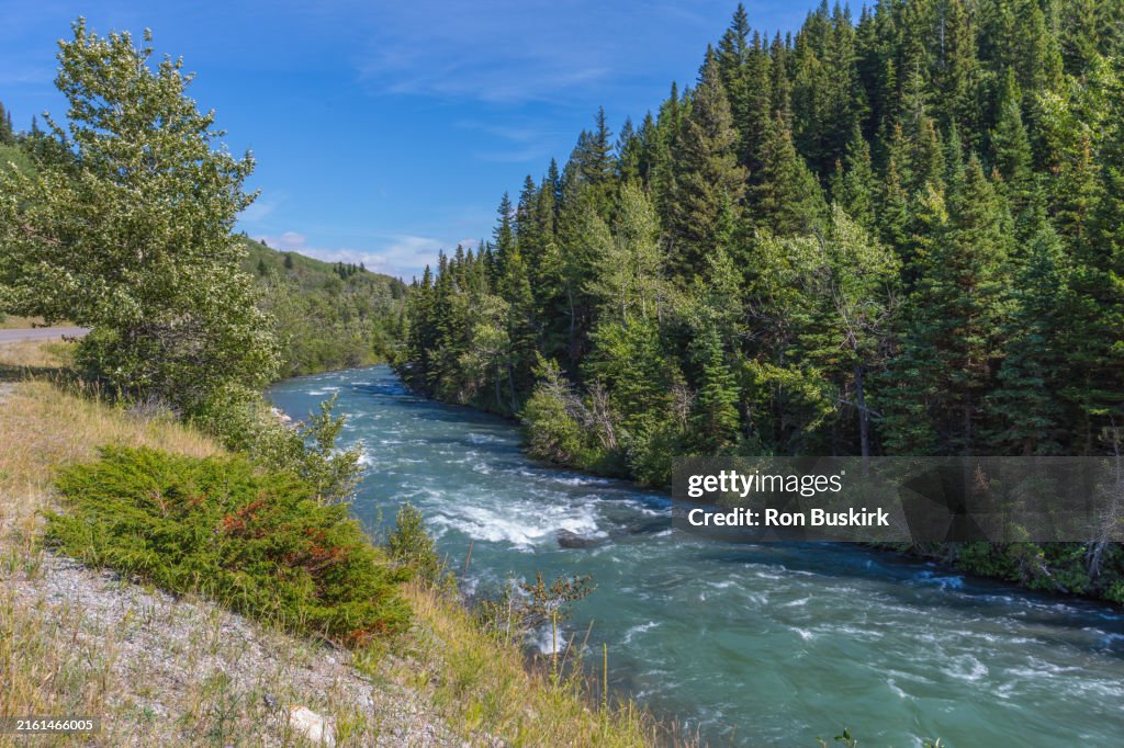 Swift current Creek flows between Lake Sherburne and Lower Saint Mary Lake in Glacier National Park near Babb, Montana