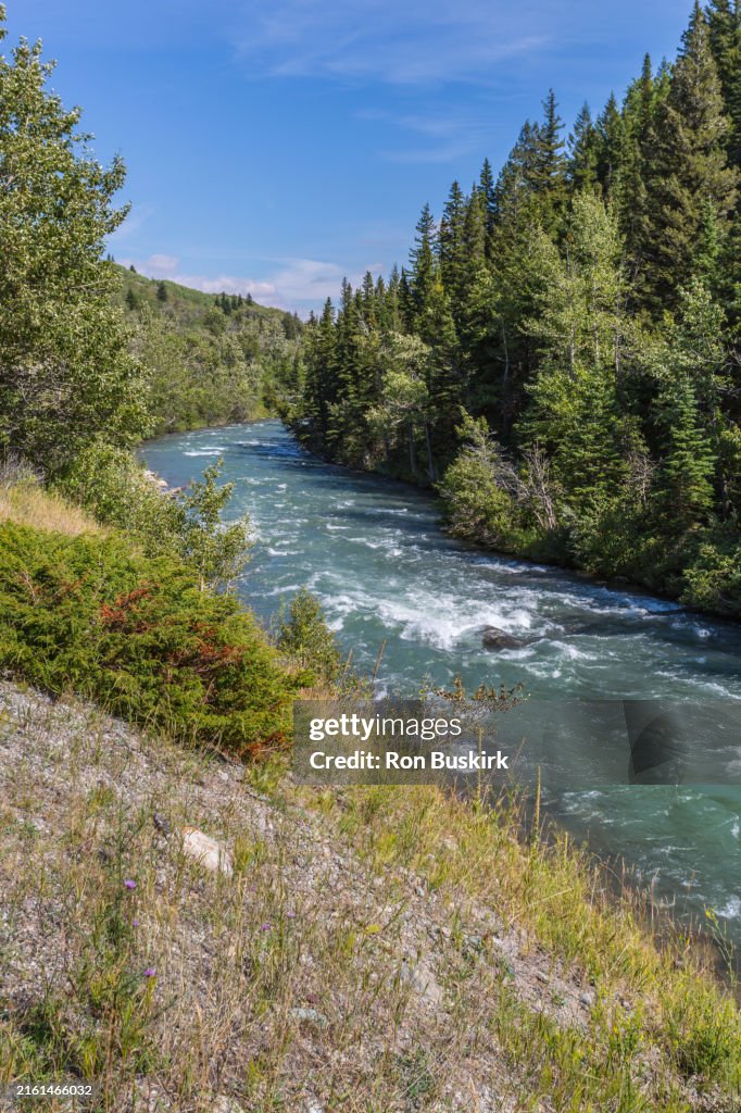 Swift current Creek flows between Lake Sherburne and Lower Saint Mary Lake in Glacier National Park near Babb, Montana