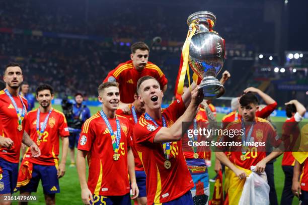Dani Olmo of Spain celebrates the European Championship with the trophy during the EURO match between Spain v England at the Olympiastadium on July...