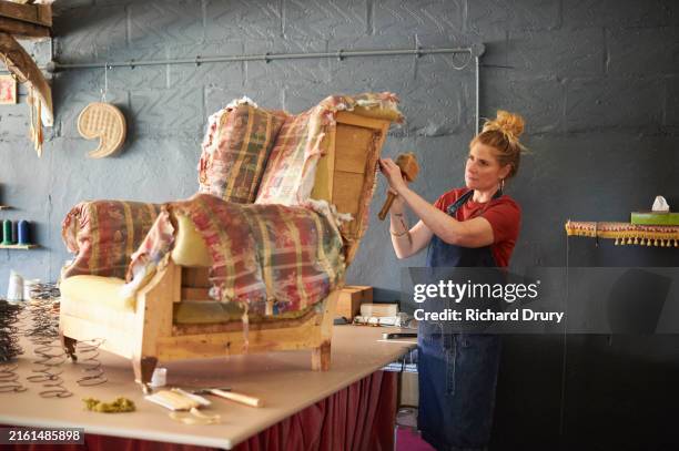 an upholsterer working on an armchair - work tool stock pictures, royalty-free photos & images